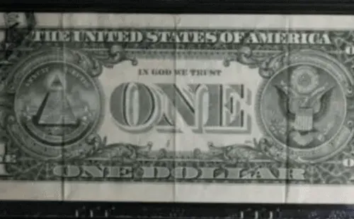 El error de impresión en la parte superior izquierda del dorso del billete de 1 dólar.