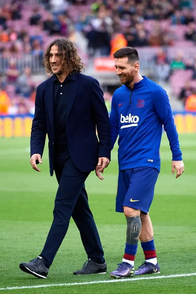 Carles Puyol junto a Messi en 2019. (Foto: Getty).