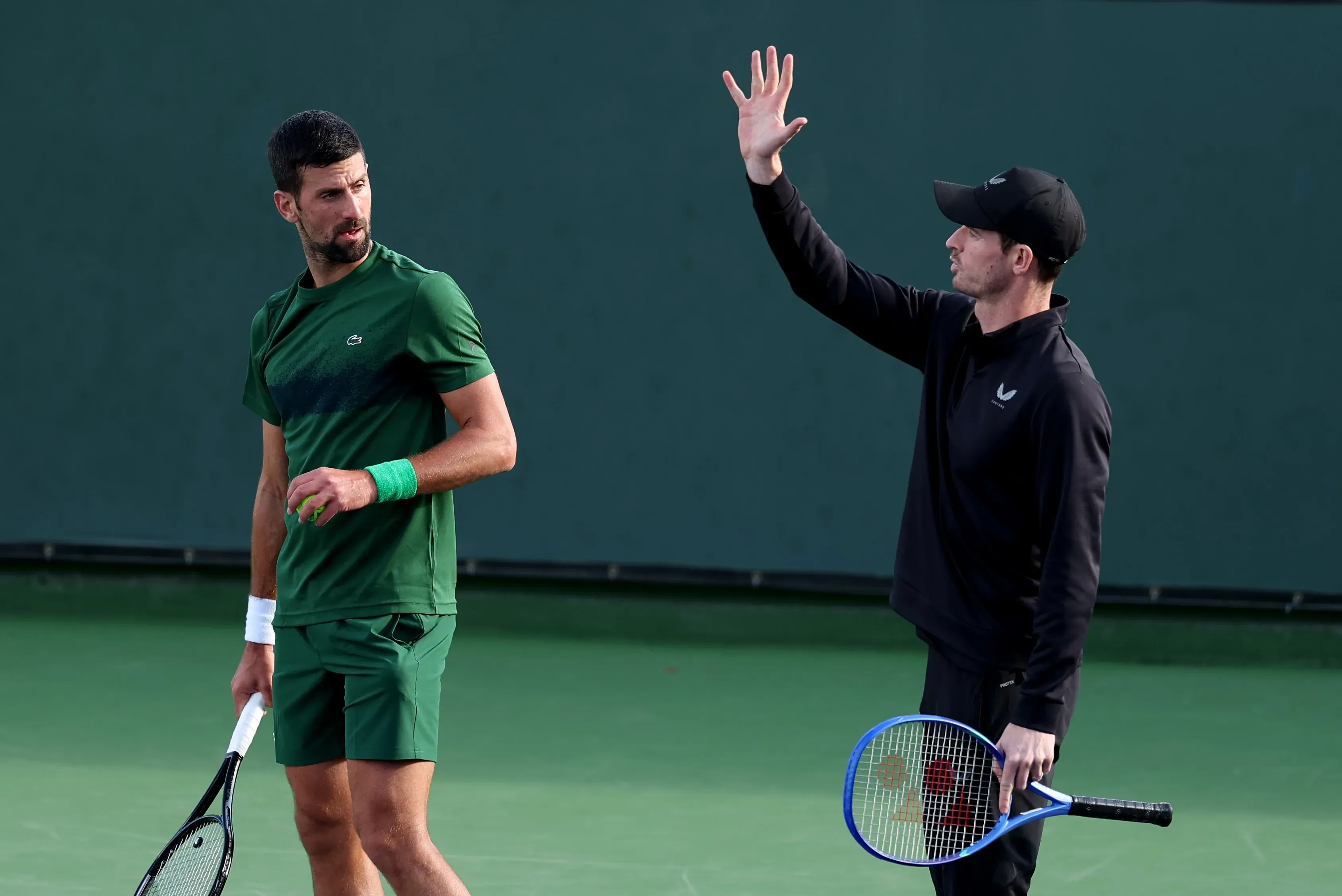 Novak Djokovic y Andy Murray, durante una práctica. (Getty Images)