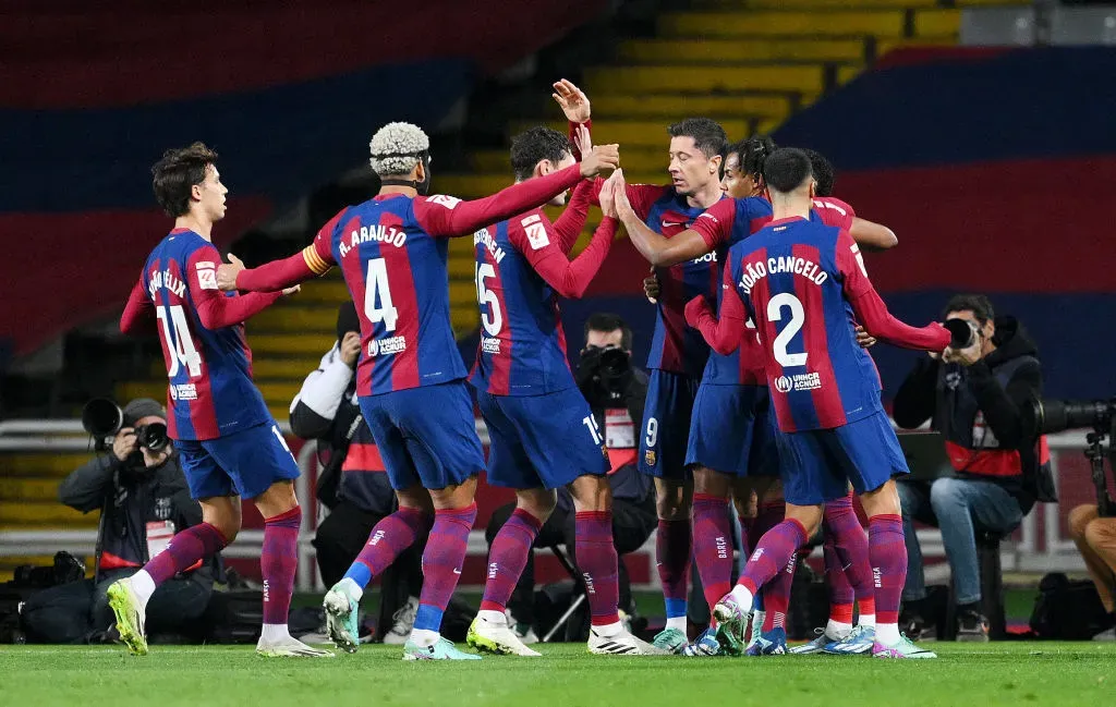 BARCELONA, SPAIN – DECEMBER 10: Robert Lewandowski of FC Barcelona celebrates with teammates after scoring their team’s first goal during the LaLiga EA Sports match between FC Barcelona and Girona FC at Estadi Olimpic Lluis Companys on December 10, 2023 in Barcelona, Spain. (Photo by David Ramos/Getty Images)