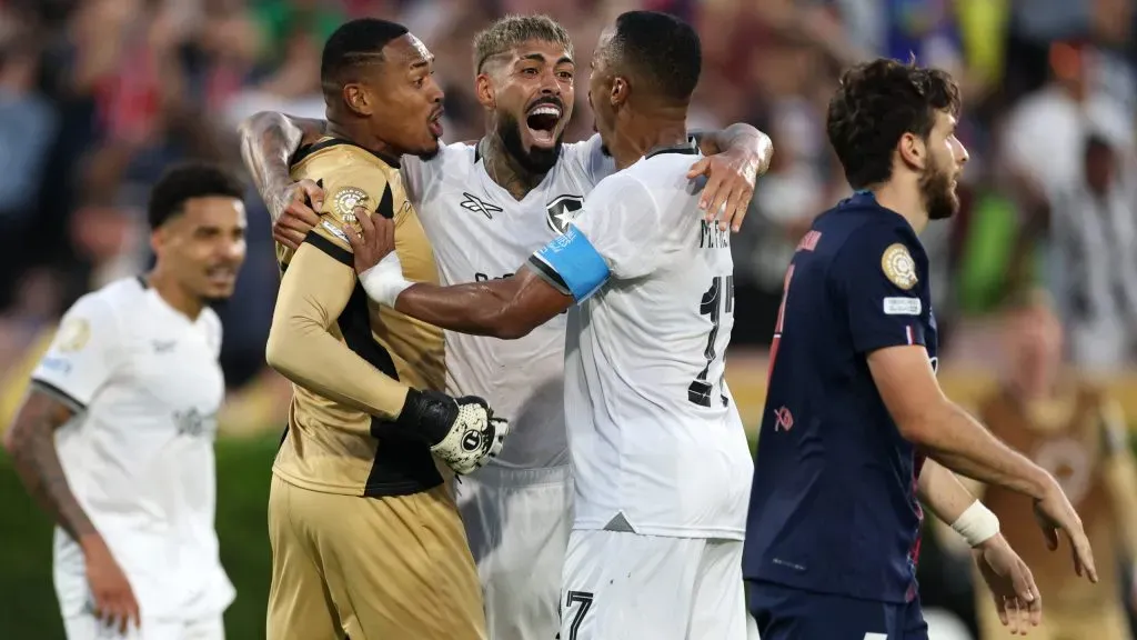 PASADENA, CALIFORNIA – JUNE 19: John #12, Alexander Barboza #20, and Marlon Freitas #17 of Botafogo celebrate following the team’s victory as Khvicha Kvaratskhelia #7 of Paris Saint-Germain looks on the FIFA Club World Cup 2025 group B match between Paris Saint-Germain FC and Botafogo FR at Rose Bowl Stadium on June 19, 2025 in Pasadena, California. (Photo by Stu Forster/Getty Images)