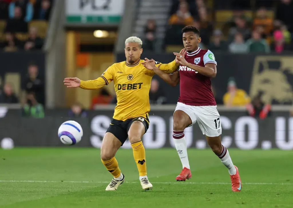 WOLVERHAMPTON, ENGLAND – APRIL 01: Joao Gomes of Wolverhampton Wanderers is challenged by Luis Guilherme of West Ham United during the Premier League match between Wolverhampton Wanderers FC and West Ham United FC at Molineux on April 01, 2025 in Wolverhampton, England. (Photo by David Rogers/Getty Images)