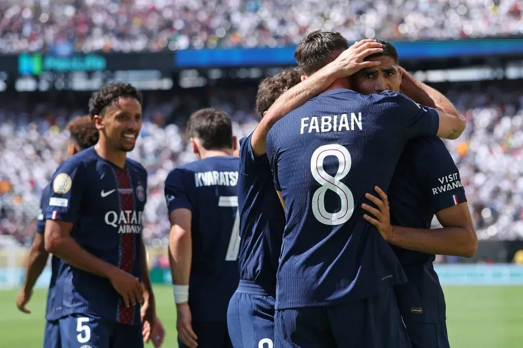 EAST RUTHERFORD, NEW JERSEY – JULY 09: Fabian Ruiz #8 of Paris Saint-Germain celebrates scoring his team’s third goal with teammate Achraf Hakimi during the FIFA Club World Cup 2025 semi-final match between Paris Saint-Germain and Real Madrid CF at MetLife Stadium on July 09, 2025 in East Rutherford, New Jersey. (Photo by Buda Mendes/Getty Images)