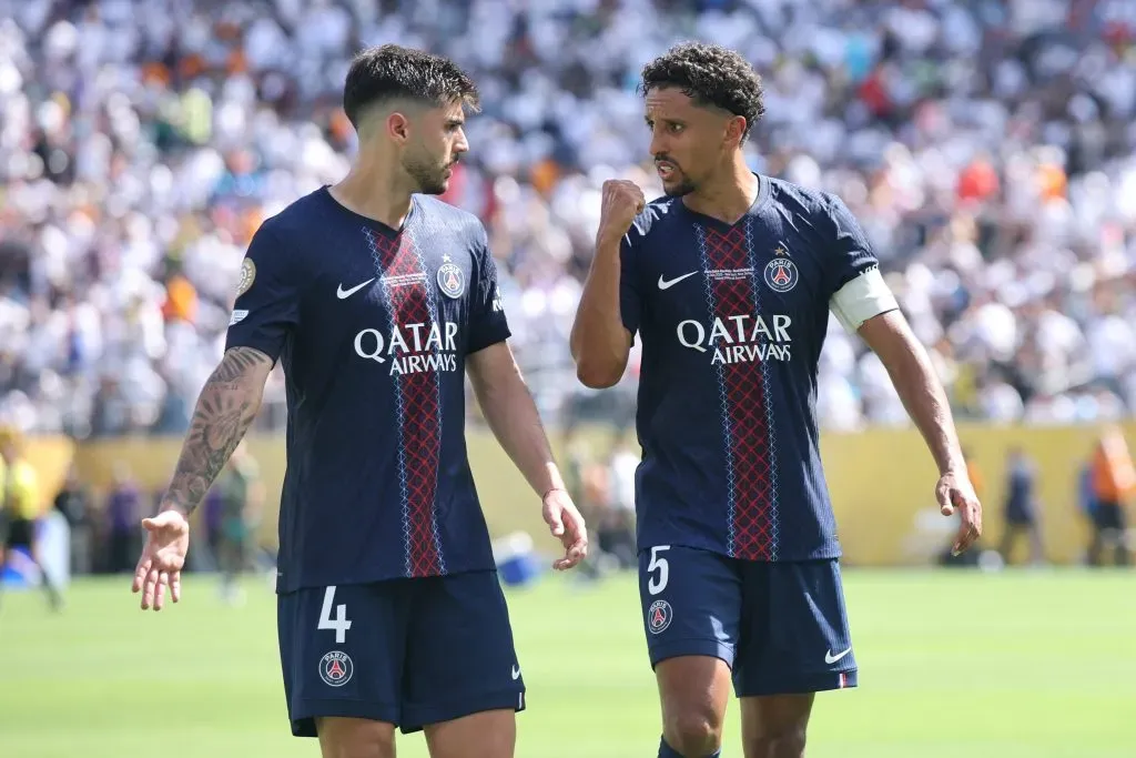 EAST RUTHERFORD, NEW JERSEY – JULY 09: Lucas Beraldo and Marquinhos #5 of Paris Saint-Germain interact during the FIFA Club World Cup 2025 semi-final match between Winner Game 59 and Winner Game 60 at MetLife Stadium on July 09, 2025 in East Rutherford, New Jersey. (Photo by Alex Grimm/Getty Images)
