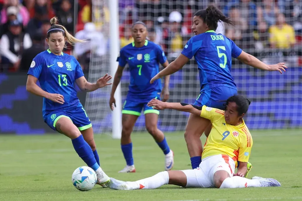 QUITO, ECUADOR – AUGUST 2: Mayra Ramirez of Colombia battles for possession against Duda Sampaio and Fernanda Palermo of Brazil during the CONMEBOL Copa America Femenina 2025 Final match between Colombia and Brazil at Rodrigo Paz Delgado Stadium on August 2, 2025 in Quito, Ecuador. (Photo by Franklin Jacome/Getty Images)
