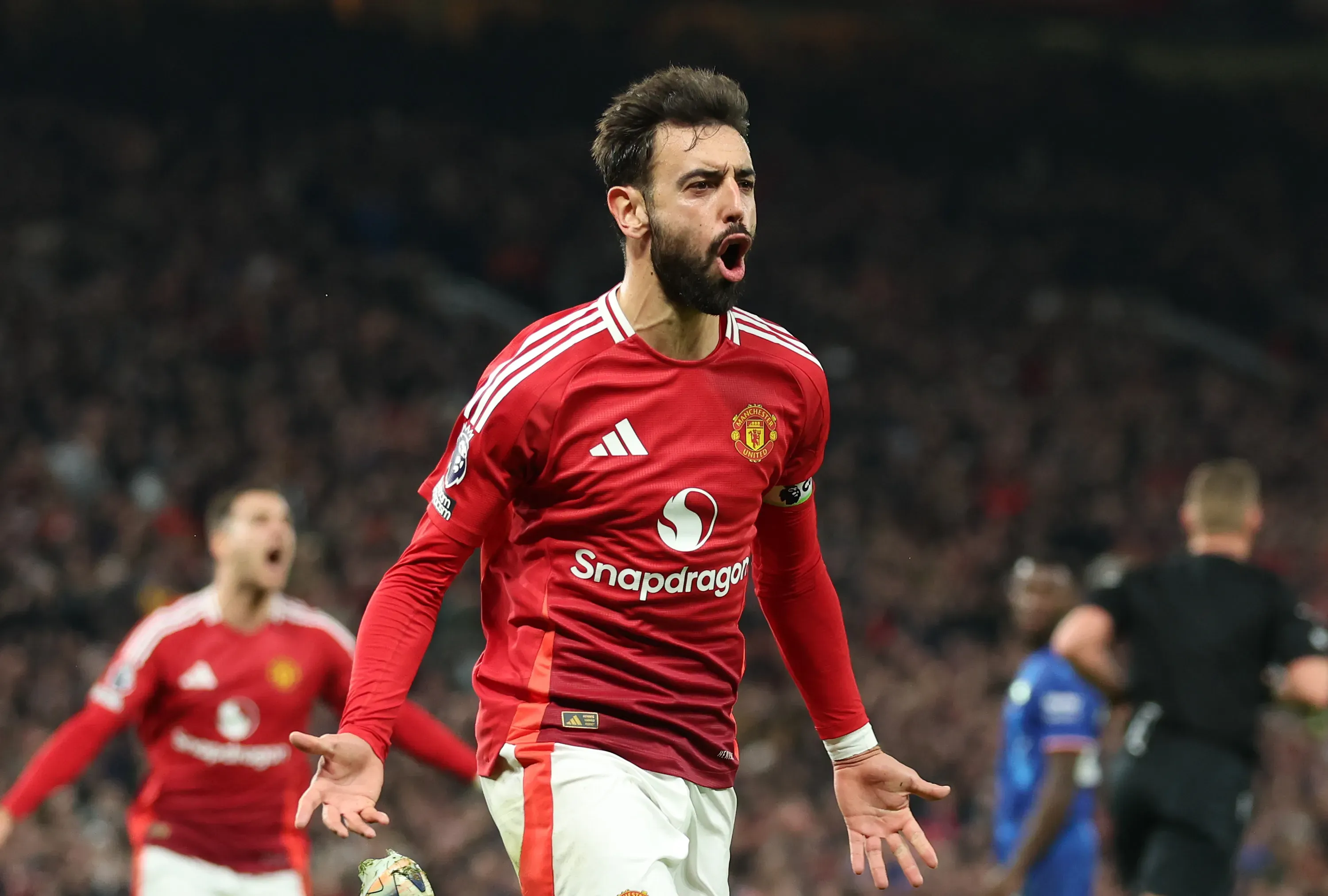MANCHESTER, ENGLAND – NOVEMBER 03: Bruno Fernandes of Manchester United celebrates after scoring his team’s first goal from a penalty kick during the Premier League match between Manchester United FC and Chelsea FC at Old Trafford on November 03, 2024 in Manchester, England. (Photo by Carl Recine/Getty Images)