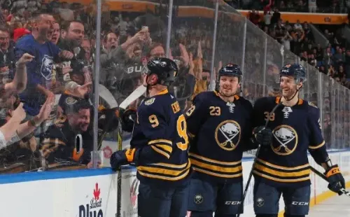 Fans connecting with the players during an NHL game. (Photo: Getty)