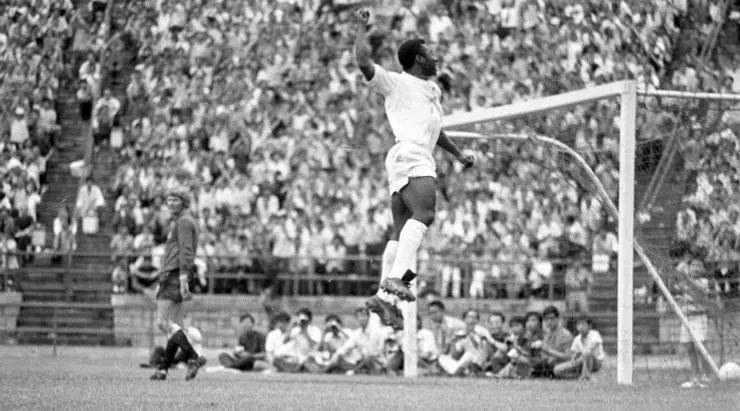 Pele celebrates during an exhibition game against Newcastle at the Hong Kong Stadium