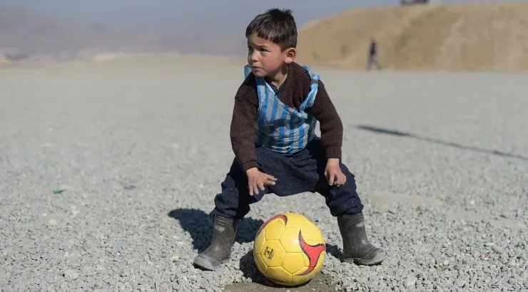 Murtaza Amadi playing with a ball in Afghanistan. (Getty)