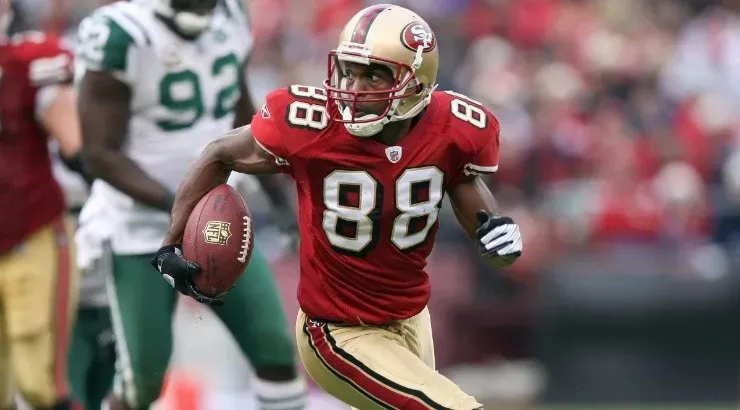 Isaac Bruce of the San Francisco 49ers carries the ball against the New York Jets. (Getty)