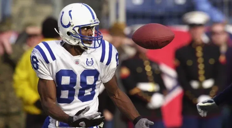 Marvin Harrison of the Indianapolis Colts has trouble catching the ball against the Tennessee Titans. (Getty)