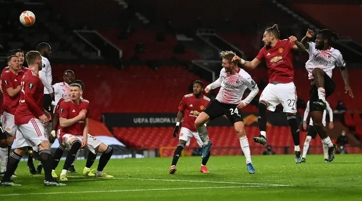 Simon Kjaer of A.C. Milan scores their teamâs first goal under pressure from Alex Telles of Manchester United (Getty)