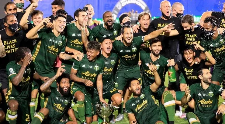 Players of Portland Timbers celebrate winning the 2020 MLS Is Back Tournament. (Getty)