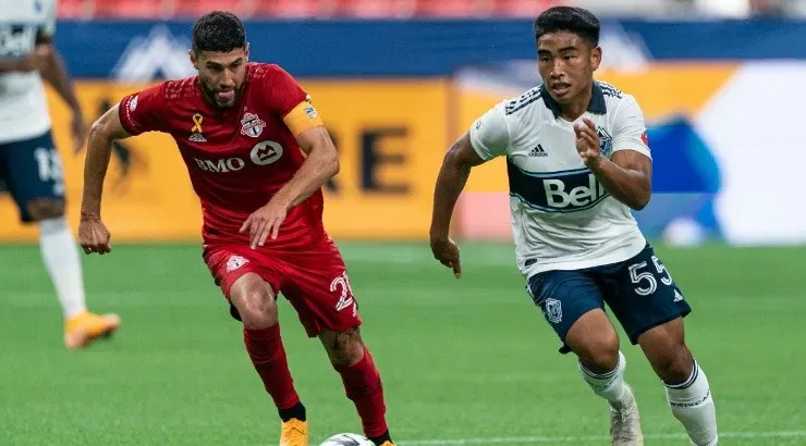 Michael Baldisimo (right) of the Vancouver Whitecaps and Jonathan Osorio (left) of the Toronto FC. (Getty)