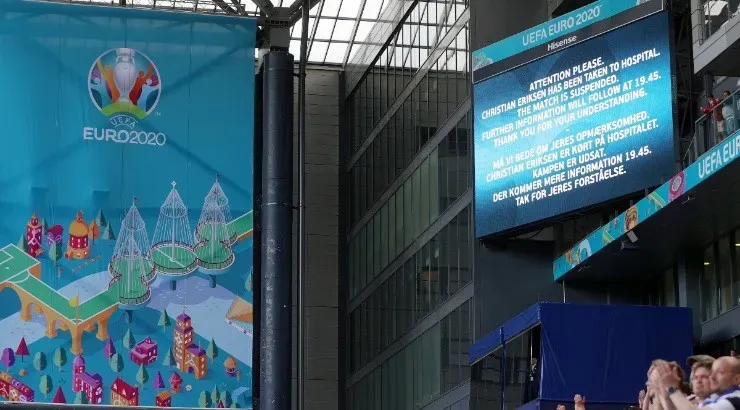 A message is displayed on the LED screen inside the stadium in Denmark vs Finland game. (Getty)