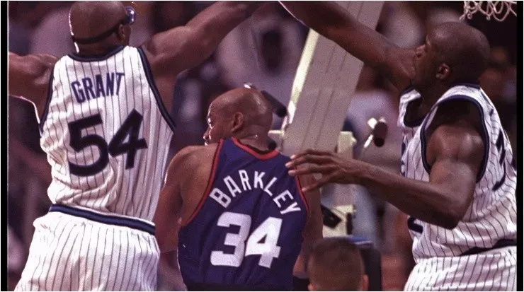 Horace Grant and Shaquille O’Neal guarding Charles Barkley. (Getty)