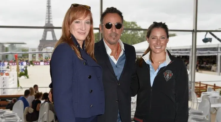 Bruce Springsteen (center) and his wife Patti Scialfa (left) pose with their daughter Jessica Springsteen (right). (Getty)
