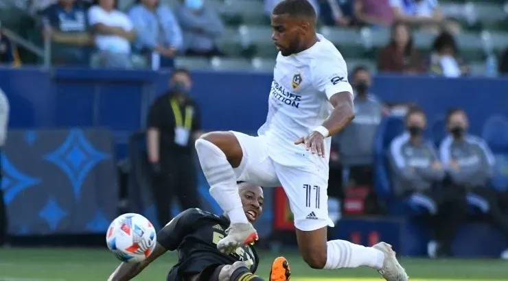 : Samuel Grandsir #11 of Los Angeles Galaxy jumps over Mark-Anthony Kaye #14 of Los Angeles FC (Getty)