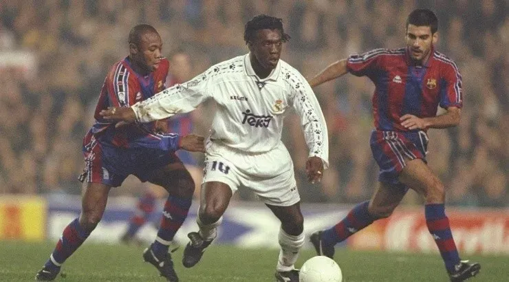 Clarence Seedorf of Real and Guardiola of Barcelona challenge for the ball. (Getty Images)