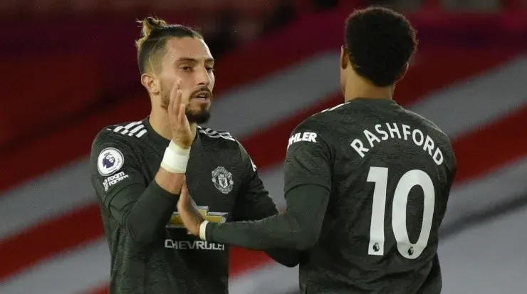 Alex Telles (left) and Marcus Rashford. (Rui Vieira – Pool/Getty Images)