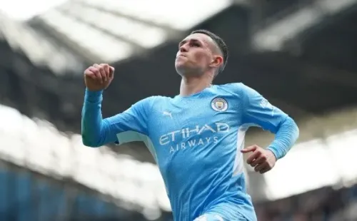 Phil Foden of Manchester City celebrates scoring their side's fourth goal during the Premier League match between Manchester City and Newcastle United at Etihad Stadium on May 08, 2022 in Manchester, England