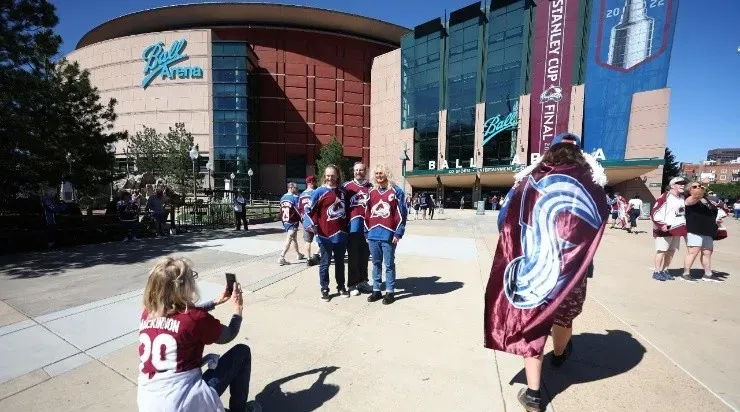 Fans pose in front of Ball Arena before Game One of the 2022 Stanley Cup Final between the Colorado Avalanche and the Tampa Bay Lightning at Ball Arena on June 15, 2022 in Denver, Colorado. (Photo by Matthew Stockman/Getty Images)