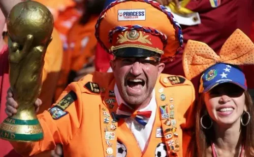 This Dutch fan, world cup in hand, rooting for his team (Getty Images)