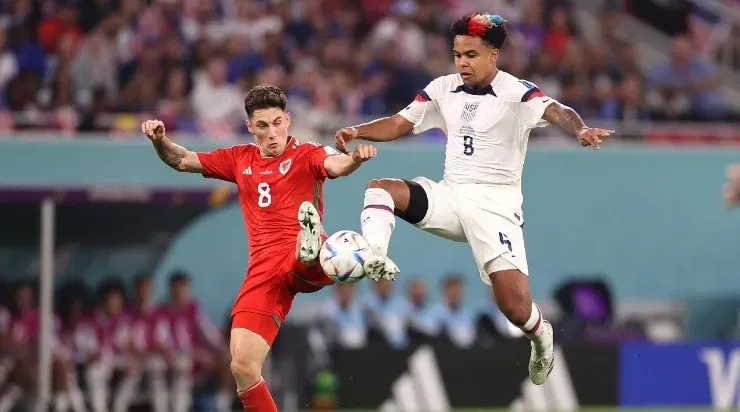 Harry Wilson of Wales battles for possession with Weston McKennie of United States (Photo by Ryan Pierse/Getty Images)