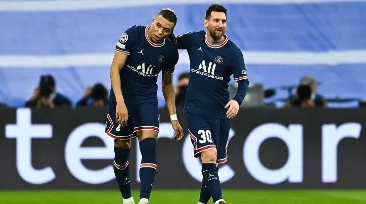 Kylian Mbappe of Paris Saint-Germain celebrates after scoring his team’s first goal with Lionel Messi of Paris Saint-Germain during the UEFA Champions League Round Of Sixteen (Photo by David Ramos/Getty Images)