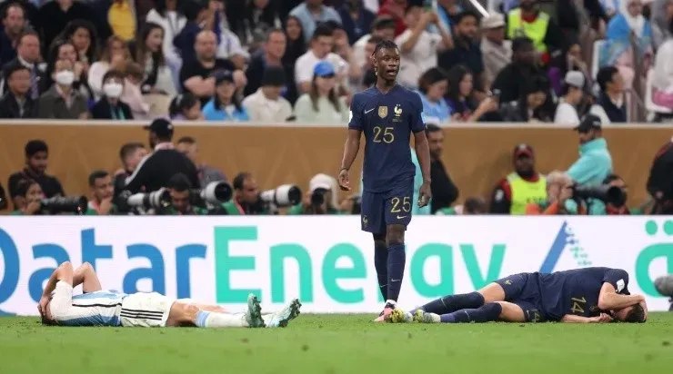Julian Alvarez of Argentina and Adrien Rabiot of France lie on the pitch after their collision during the FIFA World Cup Qatar 2022 Final (Photo by Julian Finney/Getty Images)