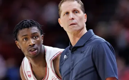 Davonte Davis #4 and Head Coach Eric Musselman of the Arkansas Razorbacks