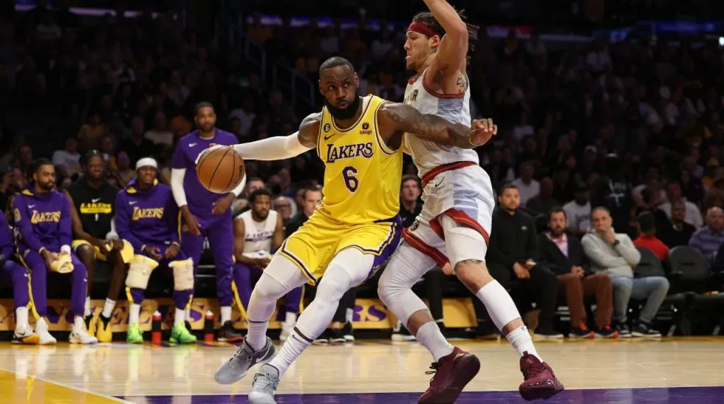 LeBron James #6 of the Los Angeles Lakers drives to the basket past Aaron Gordon #50 of the Denver Nuggets