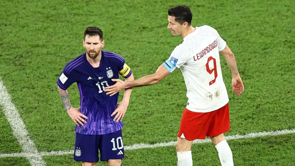 Lionel Messi is embraced by Robert Lewandowski during the FIFA World Cup Qatar 2022 Group C match between Poland and Argentina.