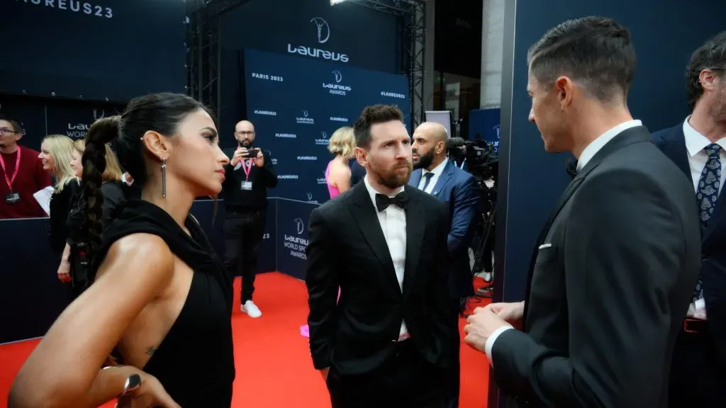 Lionel Messi and his wife Antonella Roccuzzo talk to Robert Lewandowski at the 2023 Laureus World Sport Awards Paris red carpet at Cour Vendome on May 08, 2023 in Paris, France.