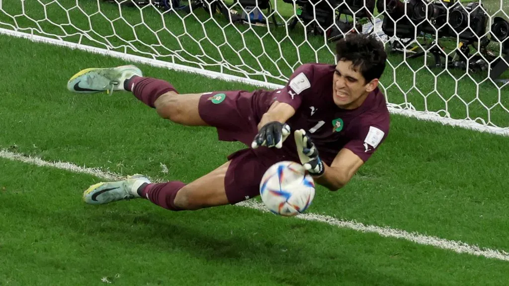 Yassine Bounou of Morocco makes a save against a penalty by Carlos Soler of Spain in the penalty shoot out during the FIFA World Cup Qatar 2022 Round of 16 match between Morocco and Spain at Education City Stadium on December 06, 2022 in Al Rayyan, Qatar. (Photo by Alexander Hassenstein/Getty Images)