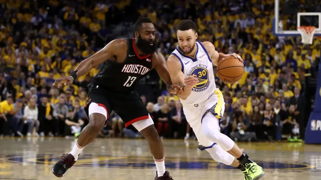 James Harden #13 of the Houston Rockets guards Stephen Curry #30 of the Golden State Warriors during Game Five of the Western Conference Semifinals of the 2019 NBA Playoffs.