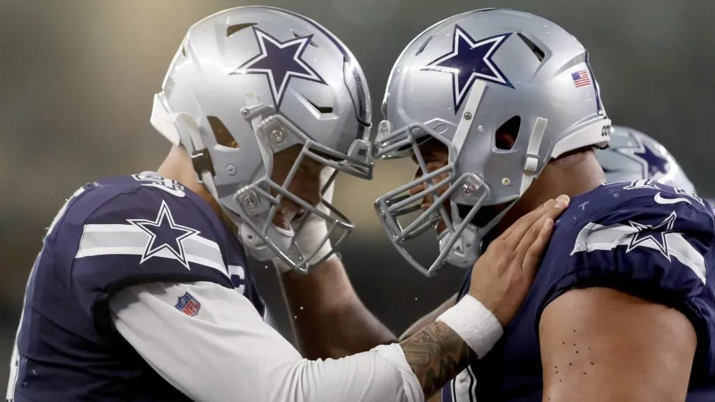 QB Dak Prescott celebrating with OL La'el Collins
