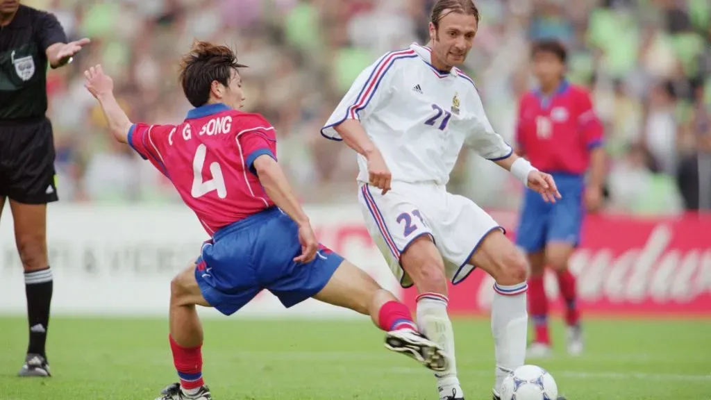 Christophe Dugarry of France is challenged by Chong Gug Song of Korea during the FIFA Confederations Cup match at the Daegu Sports Complex in Daegu, Korea. \ Mandatory Credit: Stanley Chou /Allsport