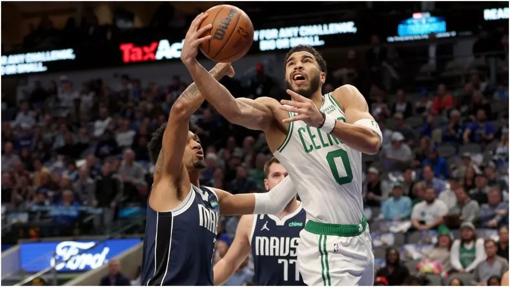Jayson Tatum #0 of the Boston Celtics drives to the basket against Jaden Hardy #3 and Luka Doncic #77 of the Dallas Mavericks – Tom Pennington/Getty Images
