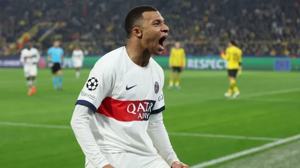 Kylian Mbappe of Paris Saint-Germain celebrates scoring a goal which was later ruled out for offside following a VAR review during the UEFA Champions League match between Borussia Dortmund and Paris Saint-Germain at Signal Iduna Park on December 13, 2023 in Dortmund, Germany.