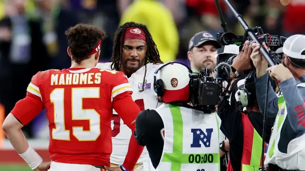 Fred Warner #54 of the San Francisco 49ers and Patrick Mahomes #15 of the Kansas City Chiefs meet at mid-field for the overtime coin toss during Super Bowl LVIII at Allegiant Stadium on February 11, 2024 in Las Vegas, Nevada.