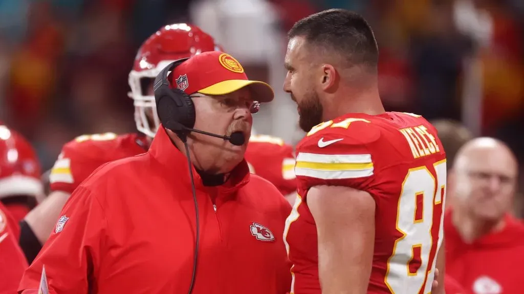 Head coach Andy Reid of the Kansas City Chiefs speaks with Travis Kelce #87 during the NFL match between Miami Dolphins and Kansas City Chiefs at Deutsche Bank Park on November 05, 2023 in Frankfurt am Main, Germany.