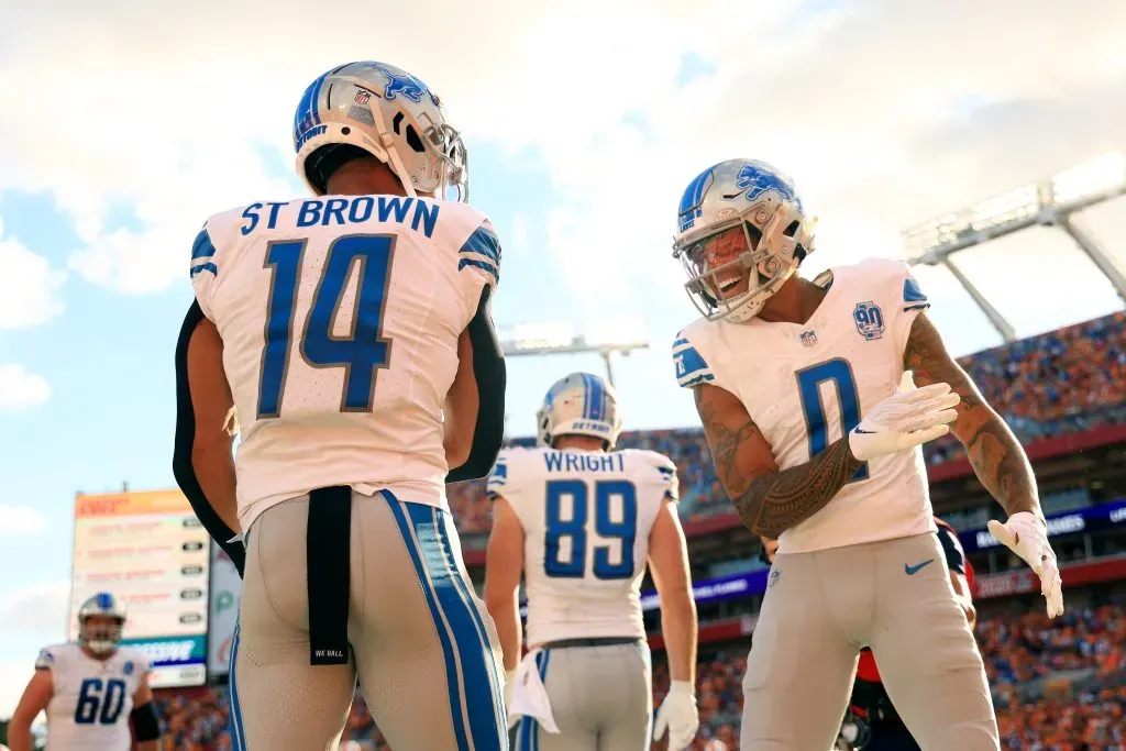 TAMPA, FLORIDA – OCTOBER 15: Amon-Ra St. Brown #14 of the Detroit Lions and Marvin Jones Jr. #0 of the Detroit Lions celebrate after St. Brown’s receiving touchdown during the second quarter against the Tampa Bay Buccaneers at Raymond James Stadium on October 15, 2023 in Tampa, Florida. (Photo by Mike Ehrmann/Getty Images)
