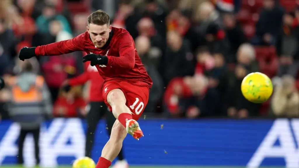 Mac Allister warms up before a Liverpool game.