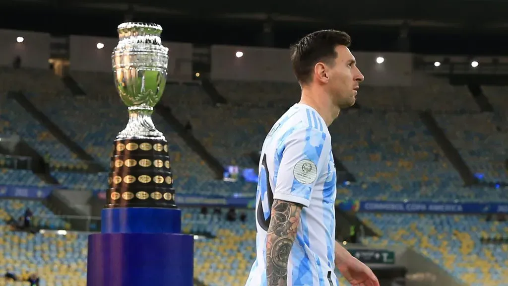 Lionel Messi of Argentina enters the pitch as he passes next to the trophy prior to the final of Copa America Brazil 2021 between Brazil and Argentina at Maracana Stadium on July 10, 2021 in Rio de Janeiro, Brazil.