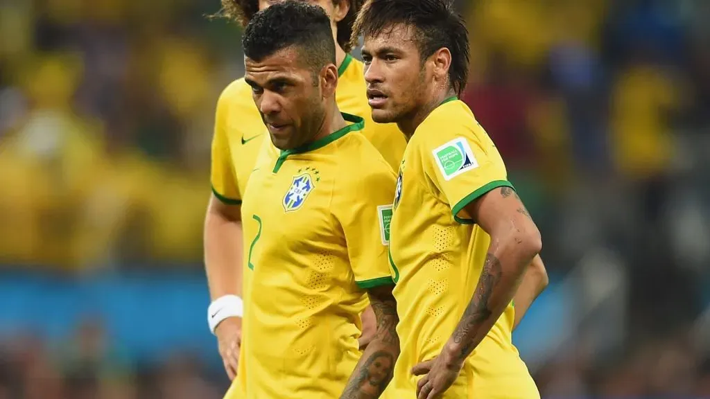 Dani Alves and Neymar of Brazil look on before a free kick during the 2014 FIFA World Cup Brazil Group A match between Brazil and Croatia at Arena de Sao Paulo on June 12, 2014 in Sao Paulo, Brazil.