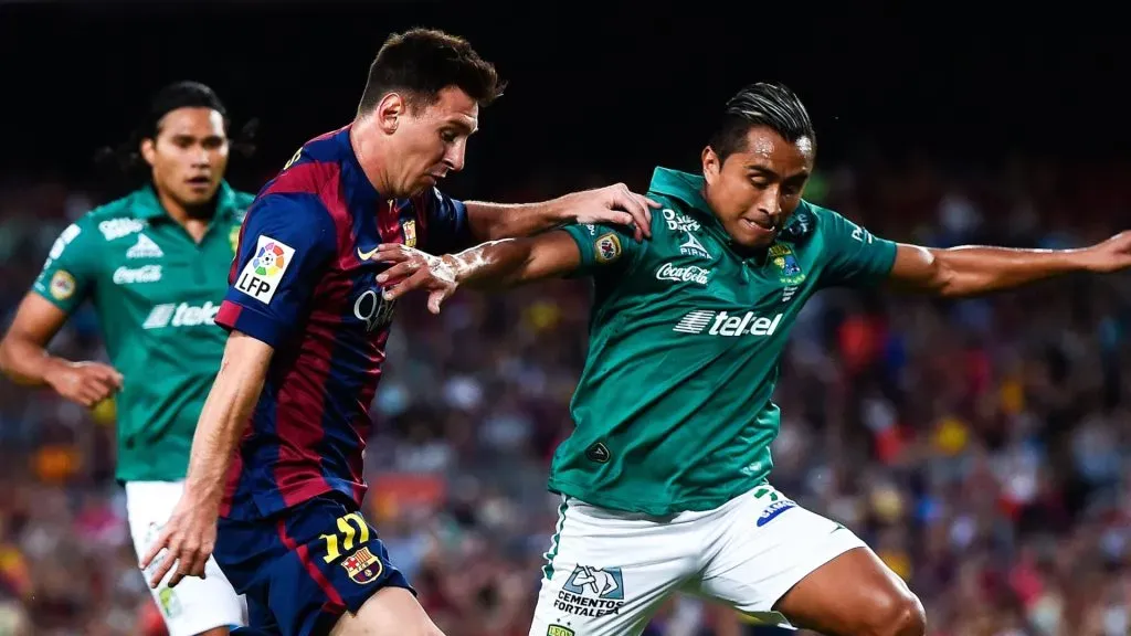 Lionel Messi of FC Barcelona competes for the ball with Edwin Hernandez of Club Leon during the Joan Gamper Trophy match between FC Barcelona and Club Leon at Camp Nou on August 18, 2014 in Barcelona, Spain.