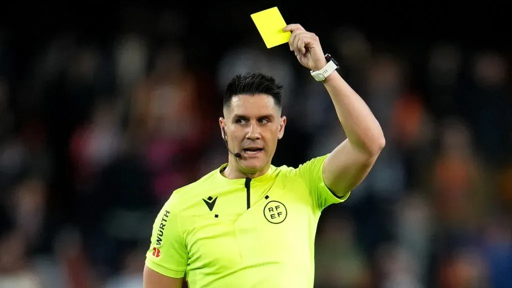 Referee, Miguel Oritz shows a yellow card to Samu Costa of RCD Mallorca (not pictured) during the LaLiga EA Sports match between Valencia CF and RCD Mallorca at Estadio Mestalla on March 30, 2024 in Valencia, Spain.