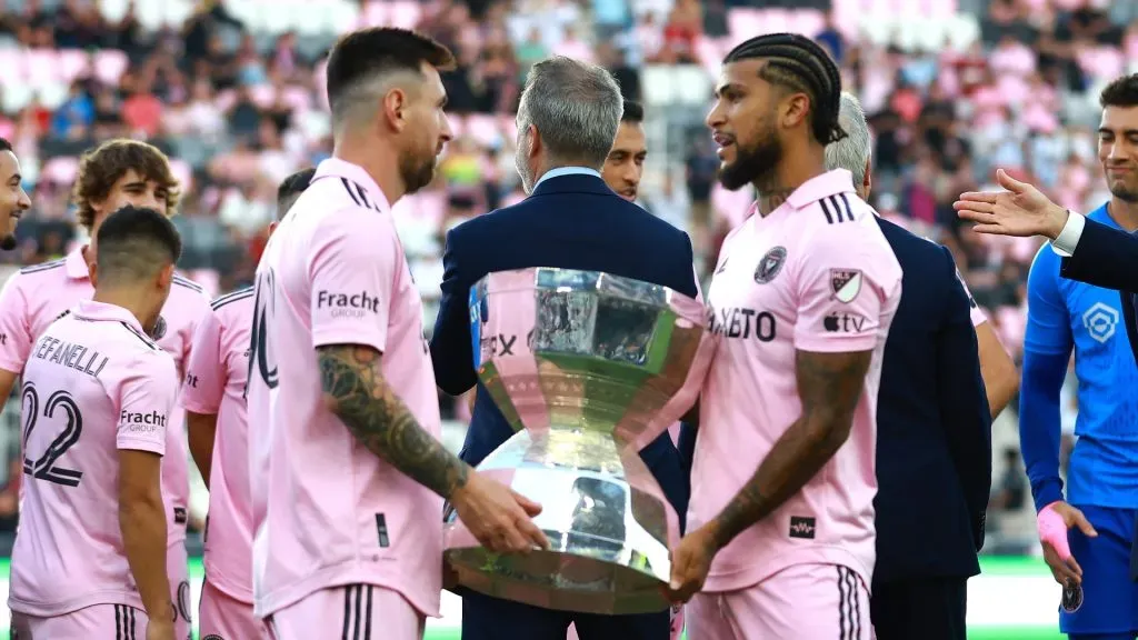 DeAndre Yedlin #2 and Lionel Messi #10 of Inter Miami CF hold the Leagues Cup trophy prior to a match between Nashville SC and Inter Miami CF at DRV PNK Stadium on August 30, 2023 in Fort Lauderdale, Florida.