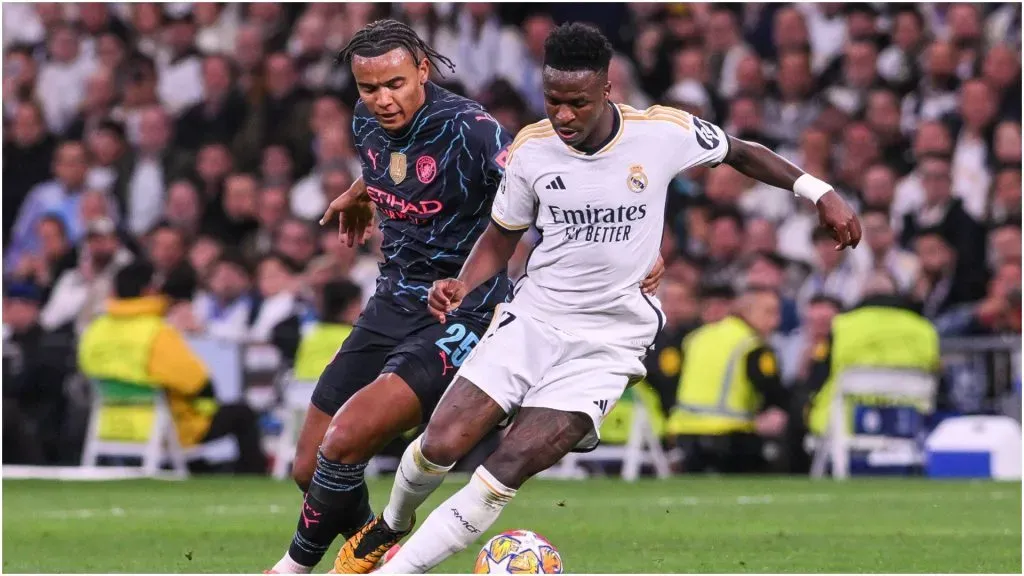 Vinicius of Real Madrid against Akanji of Manchester City